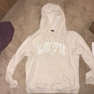 Cream colored sweatshirt